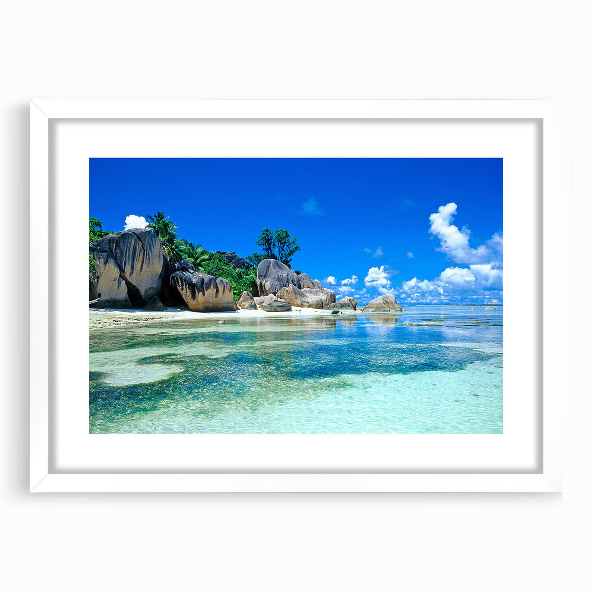 Textured abstract art print depicting Seychelles scenery in muted green and blue tones on a framed white mat.