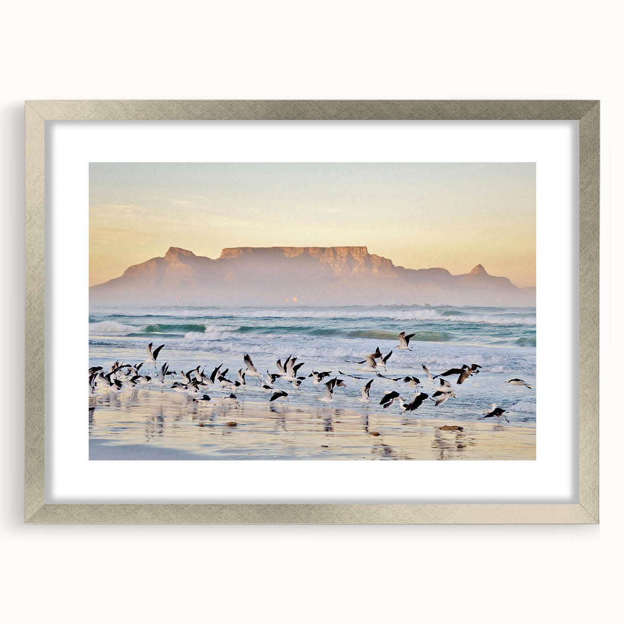 Textured art print of an abstract African landscape in muted earth tones, framed in silver, ideal for bedroom decor.