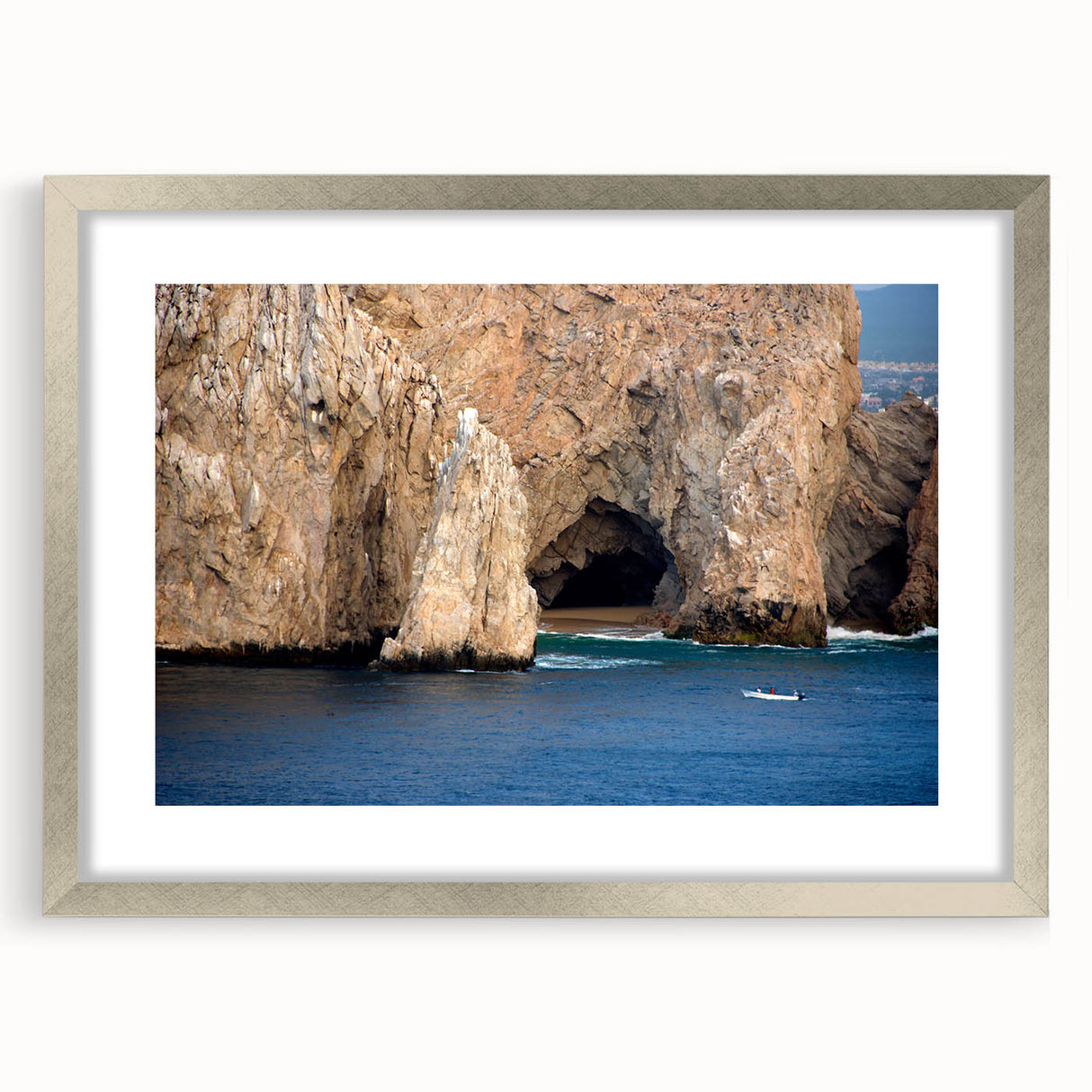 Textured art print of abstract Baja California scenery in muted earth tones on a framed silver mat, ideal for bedroom decor.
