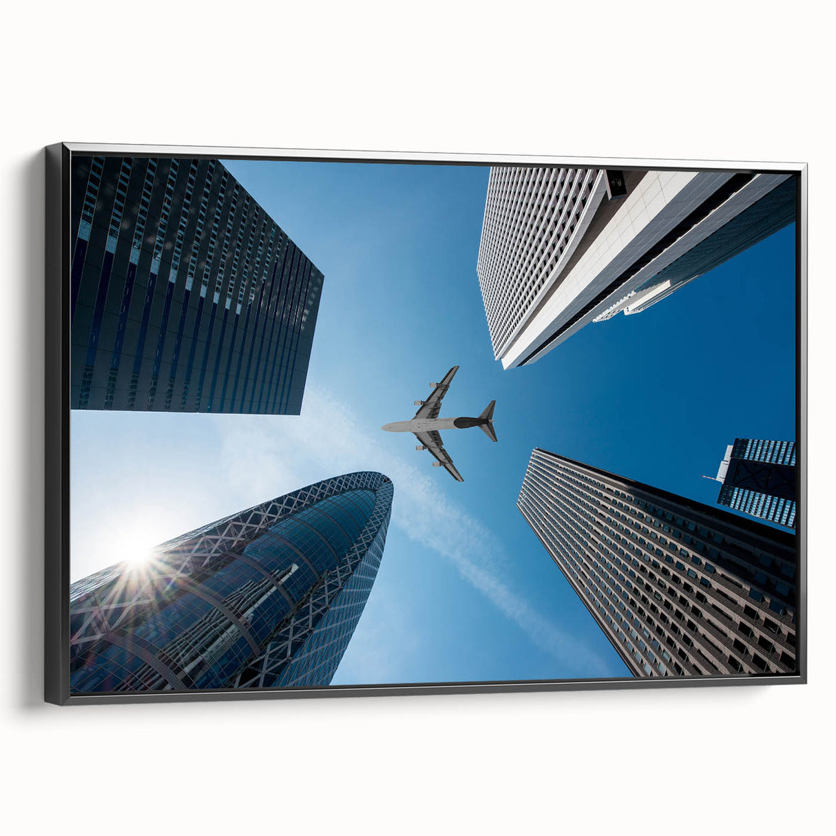 Black and white wall art featuring a vintage poster style landscape of Tokyo on a framed canvas, suitable for bedroom decor.