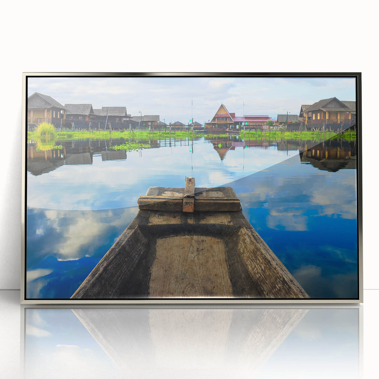 Mid-century modernist art depicting a serene Myanmar landscape in muted earth tones on a silver-framed acrylic print.