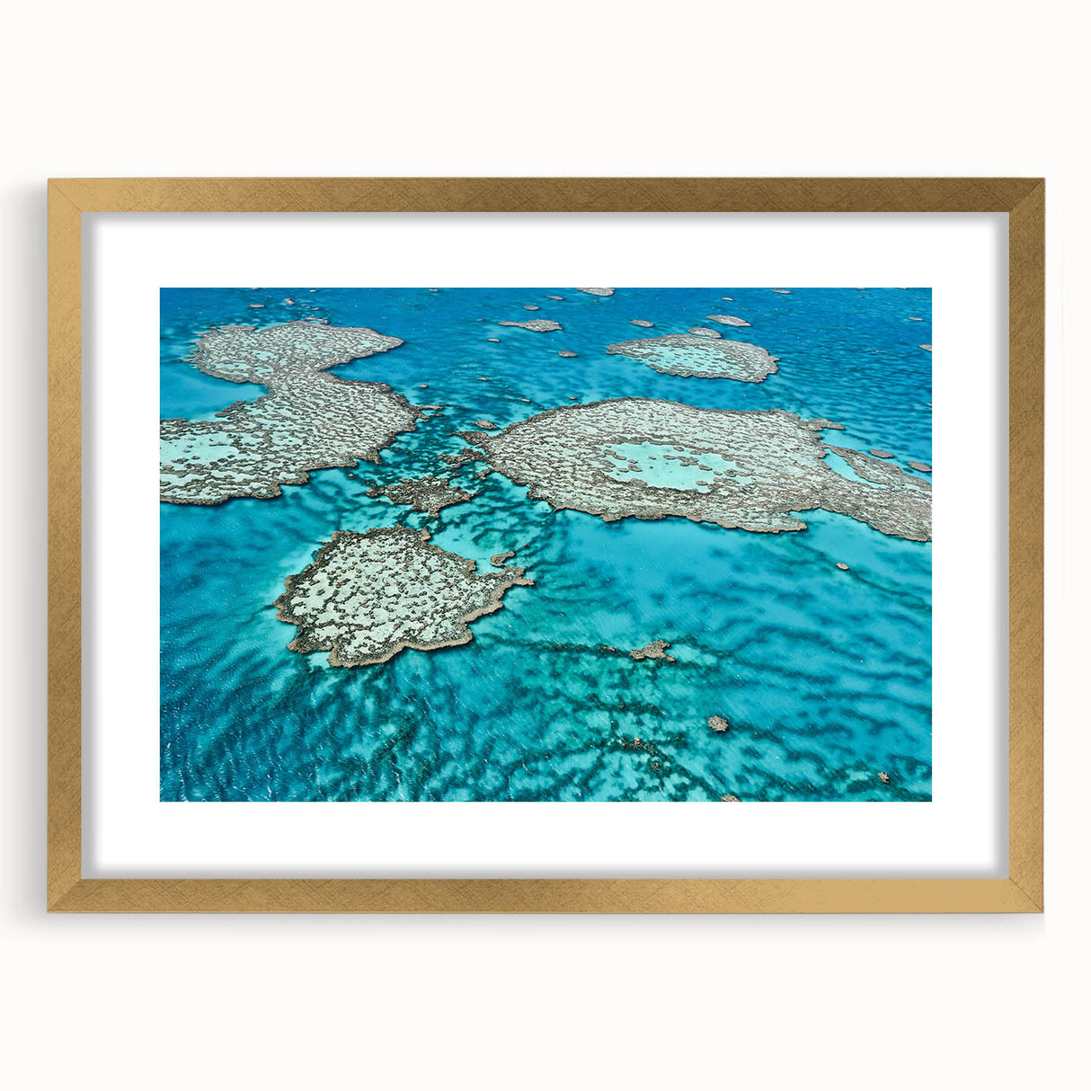 Textured art print of the Great Barrier Reef in abstract style, with blue and green hues, framed in gold.