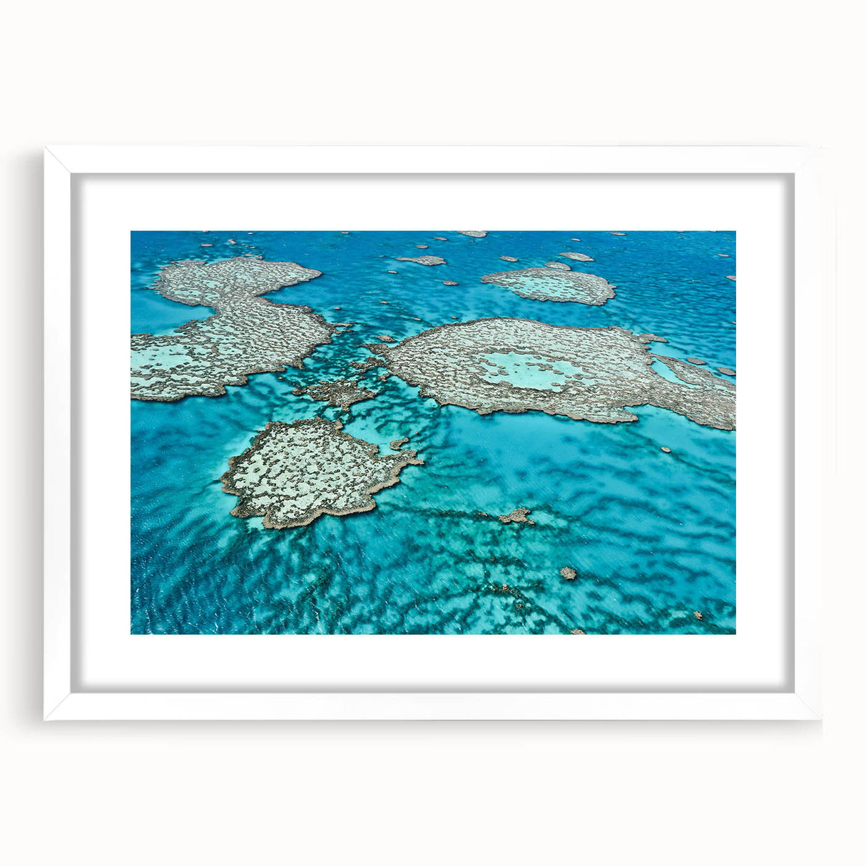 Extra large wall art of the Great Barrier Reef in abstract style, featuring vibrant blue and green hues.