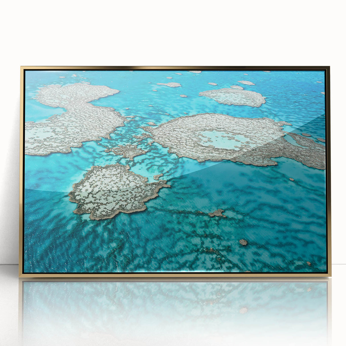 Mid-century modernist art depicting the Great Barrier Reef in vibrant blue and green tones on a framed acrylic print.
