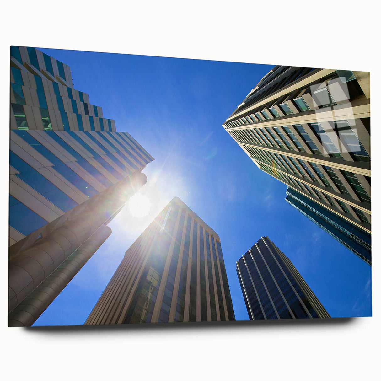 Large abstract wall art depicting the Perth skyline in muted blue and gray tones on acrylic glass.