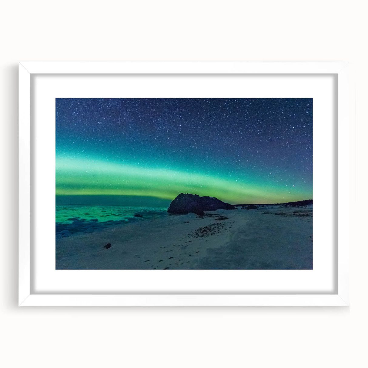 Abstract art print of Newfoundland scenery in muted green and blue tones, framed with a white mat.