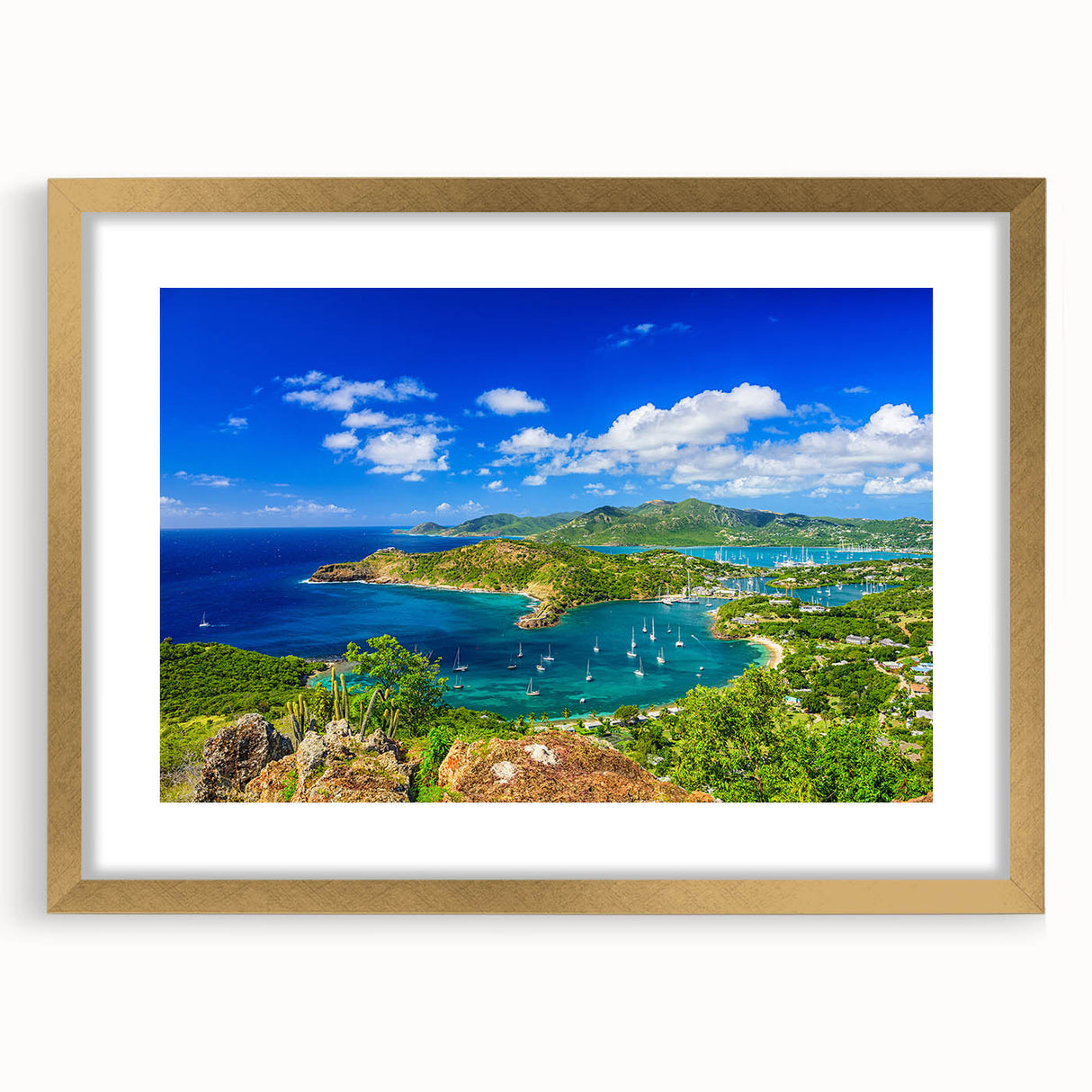 Abstract art print of Caribbean scenery in gold frame, featuring vibrant blue and green tones.