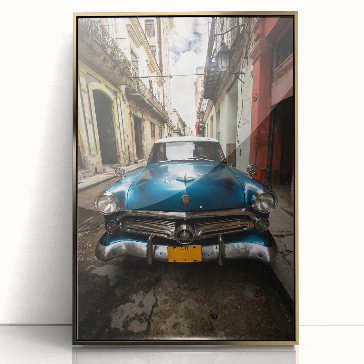 Art deco style poster of a Caribbean scene in vibrant blues and greens, framed in gold acrylic.