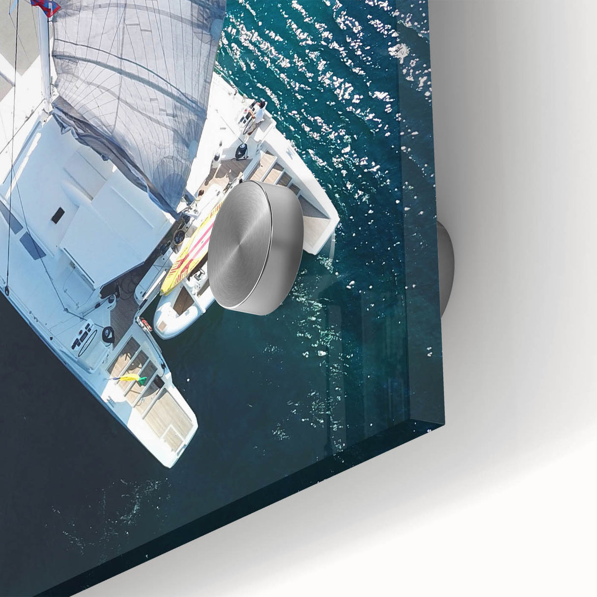 Large abstract wall art featuring a Caribbean seascape in muted blue and green tones on acrylic glass.