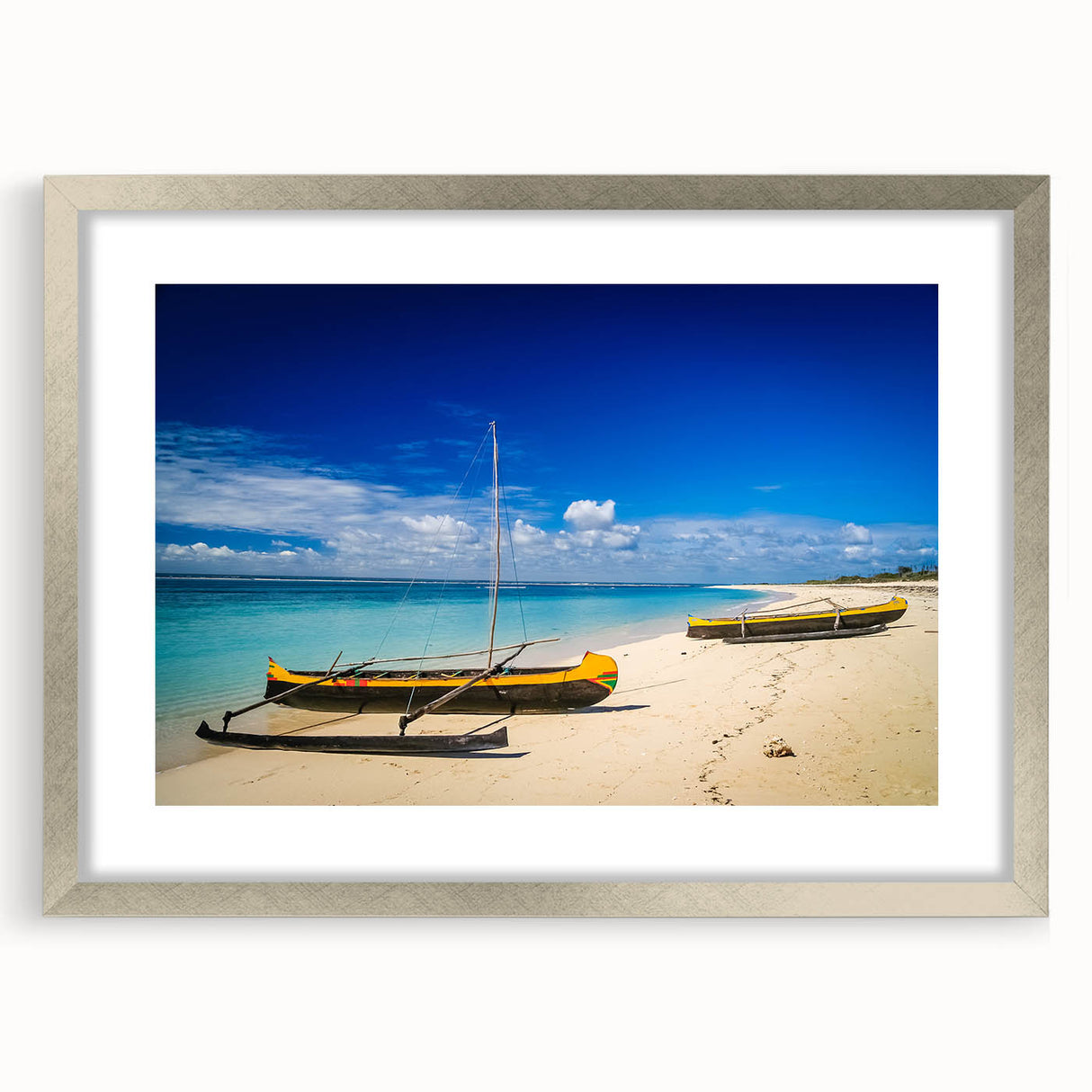 Abstract art print of a Madagascar landscape in muted earth tones on a framed silver mat, suitable for dining room decor.