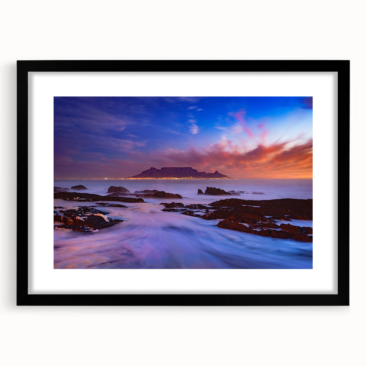 Extra large abstract art print of a vibrant African scenery on textured canvas, framed in black, ideal for living room decor.