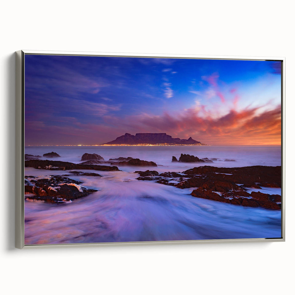 Framed canvas depicting a vintage-style African landscape in vibrant colors, ideal for enhancing a living room's ambiance.