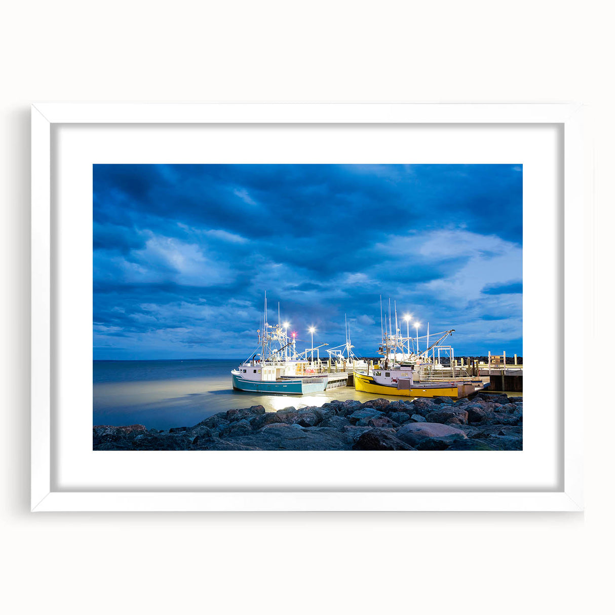Abstract art print of New Brunswick scenery in muted green and blue tones, framed with a white mat.