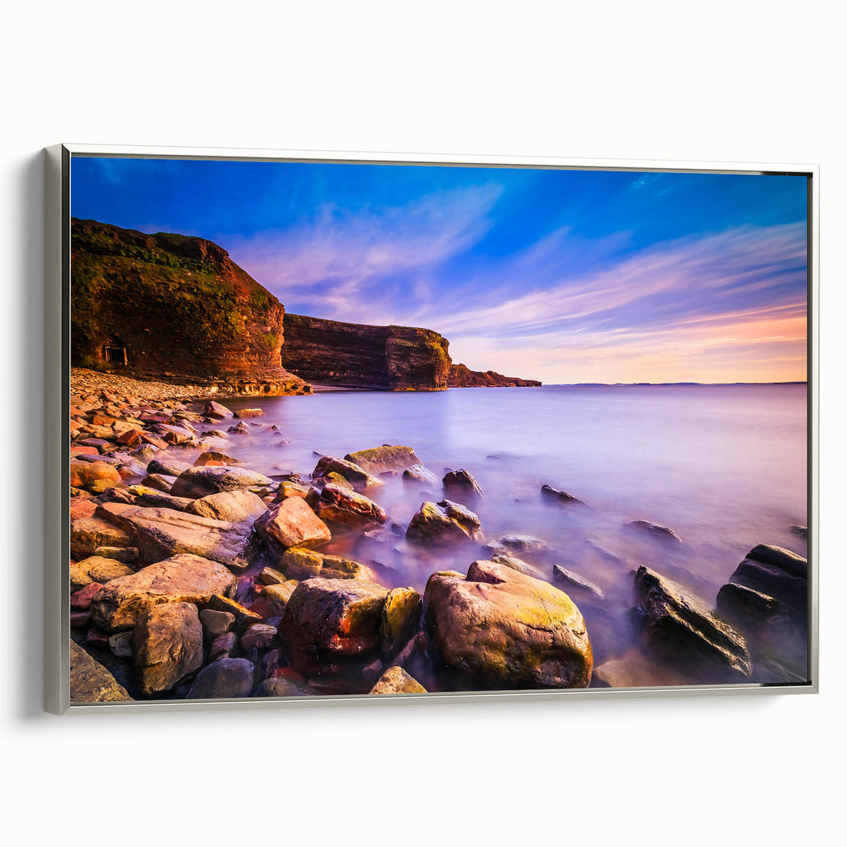 Landscape art painting of Newfoundland scenery on a silver-framed canvas, featuring vibrant colorful art with black accents.