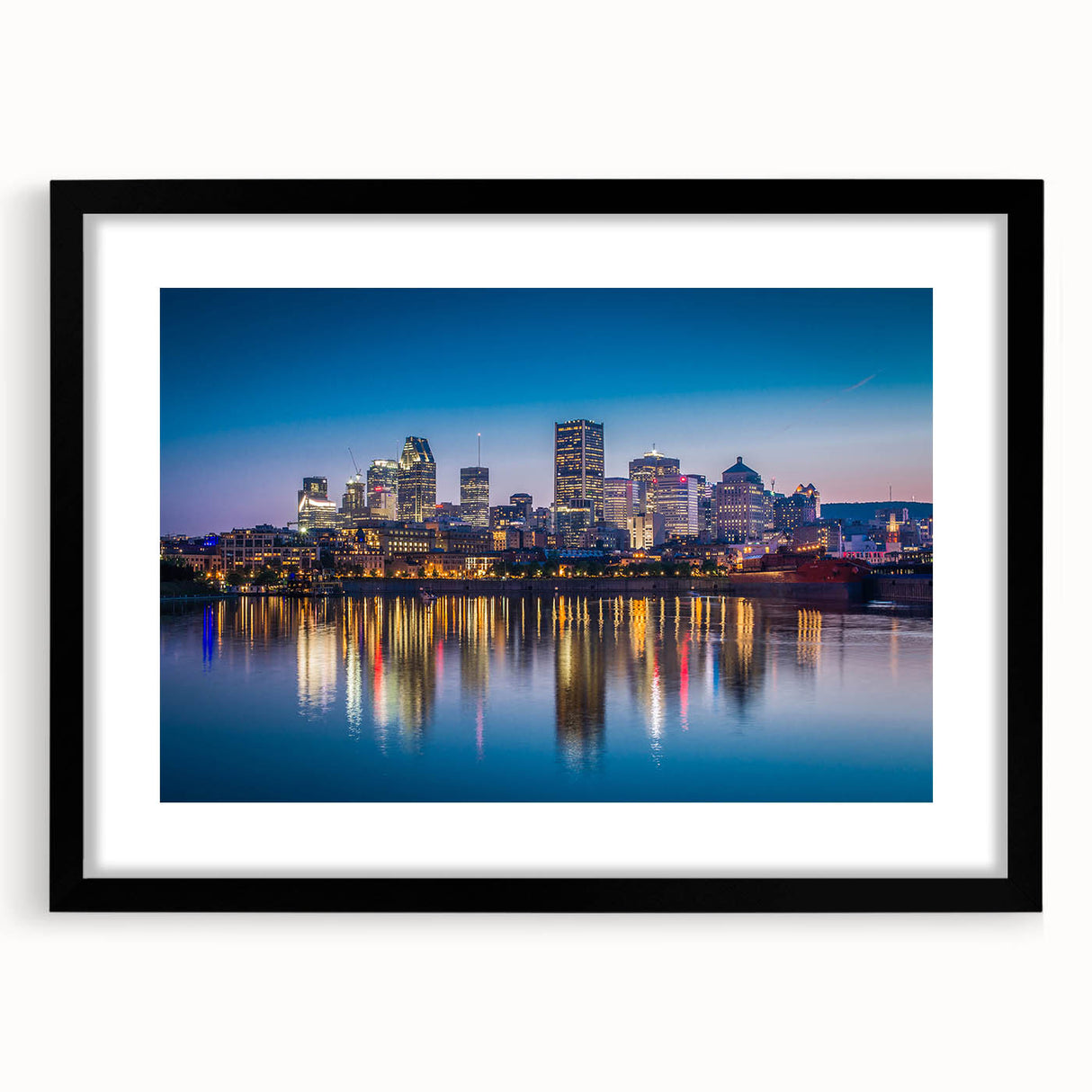Abstract art print of vibrant, colorful scenery depicting Quebec, on a large textured canvas with a black frame.