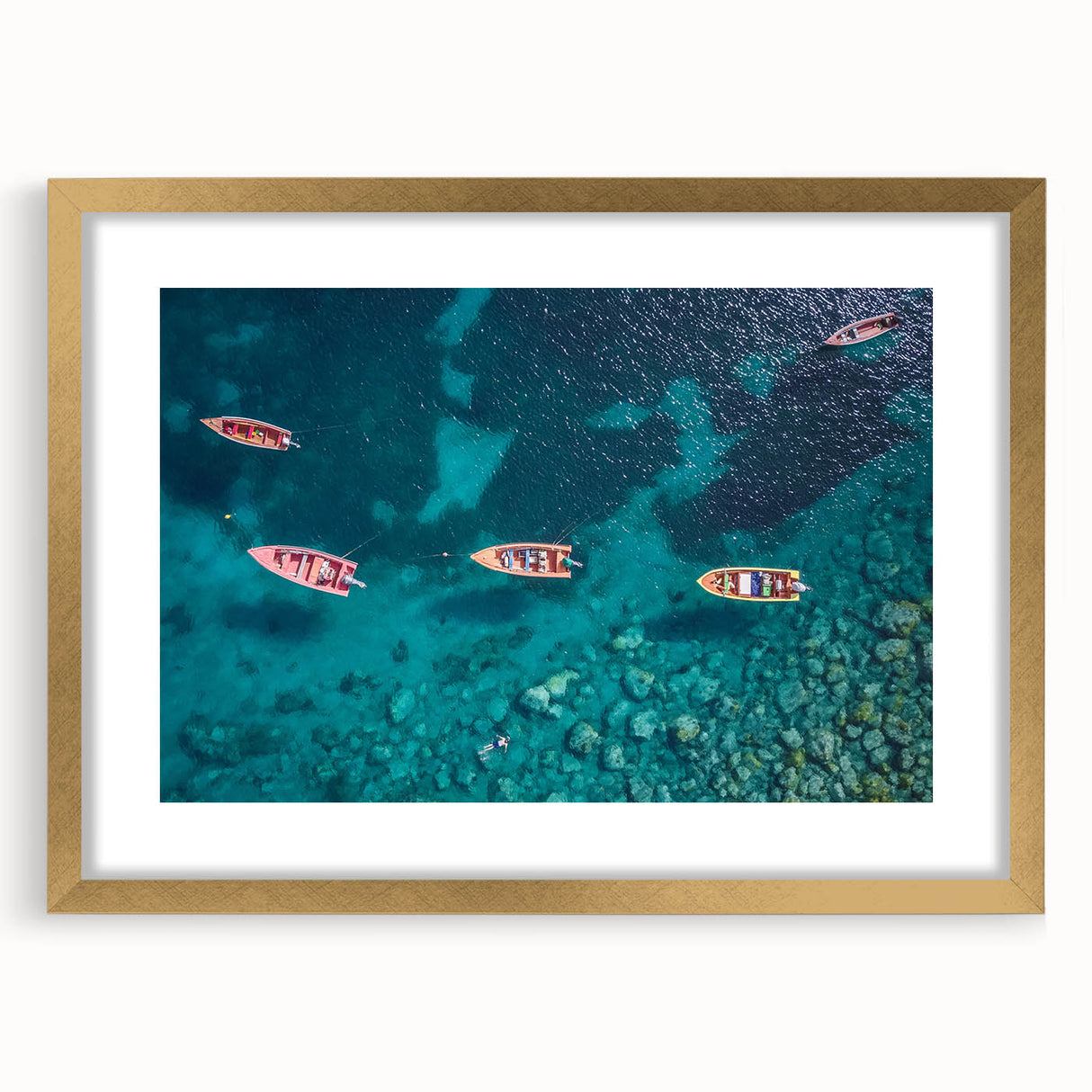 Abstract art print of a Caribbean scenery in muted blue and green tones, framed in gold, suitable for dining room decor.