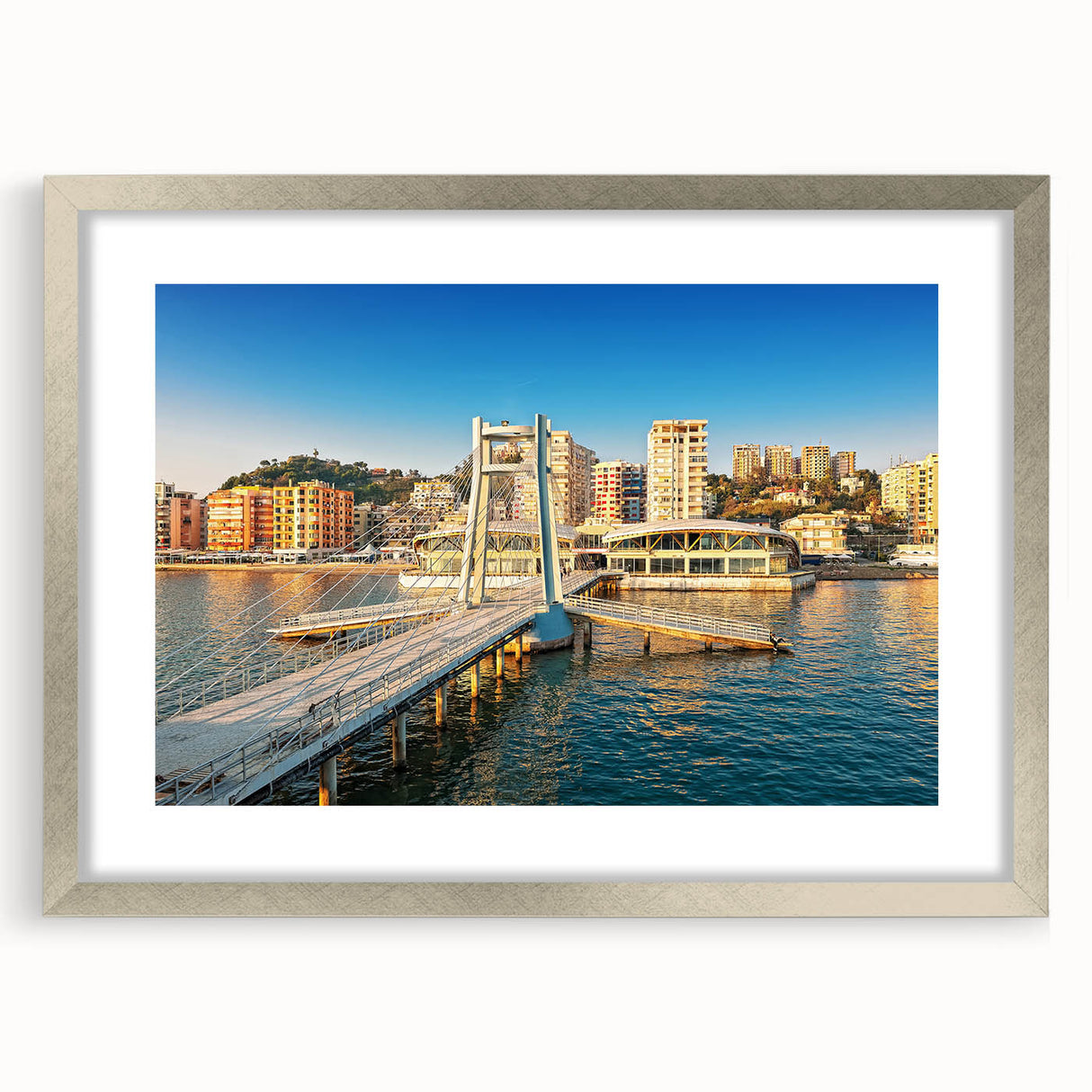 Extra large abstract art print depicting a textured European scenery in muted earth tones, framed in silver.