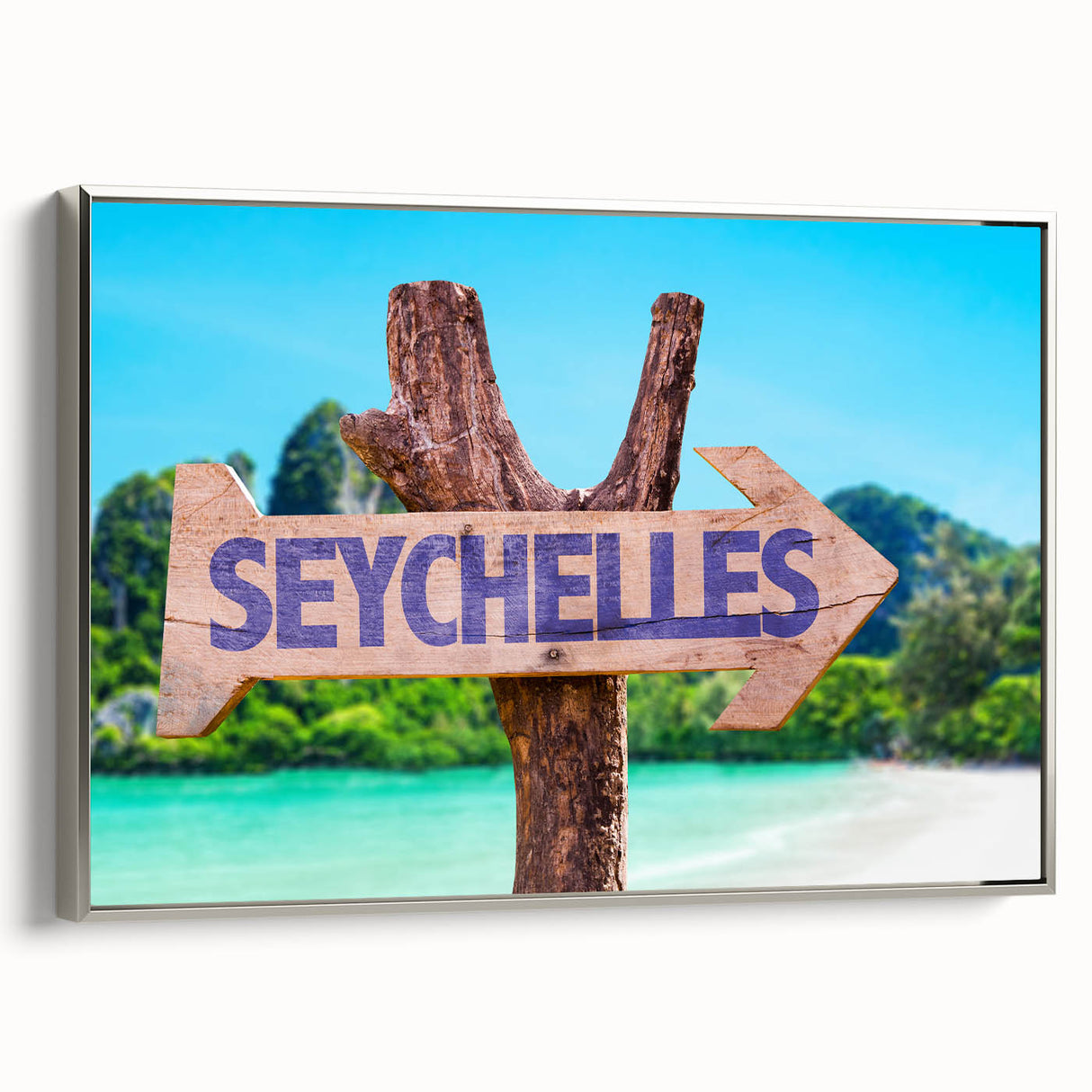 Framed canvas featuring a Seychelles landscape with vibrant green and blue tones.