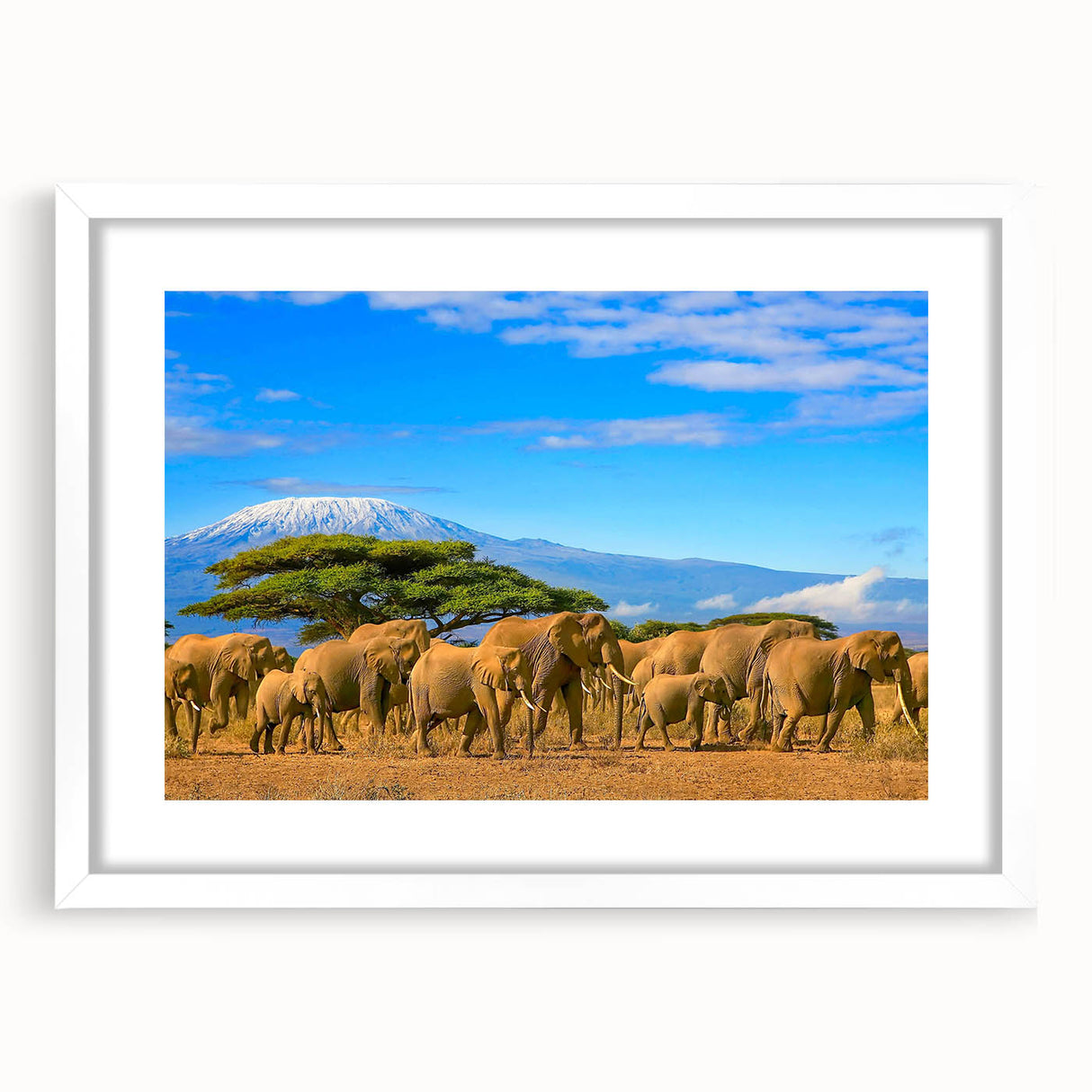 Abstract art print of African scenery in muted earth tones on a white framed canvas.
