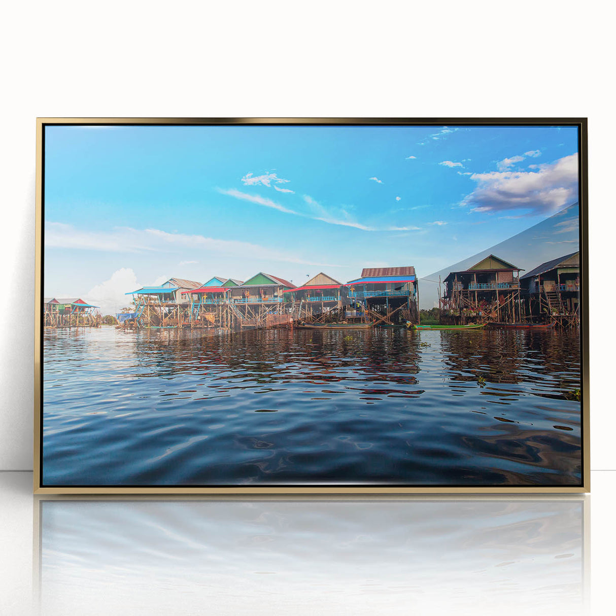 Acrylic print of a Cambodian landscape in muted gold and green tones, framed in gold, suitable for modern art wall decor.