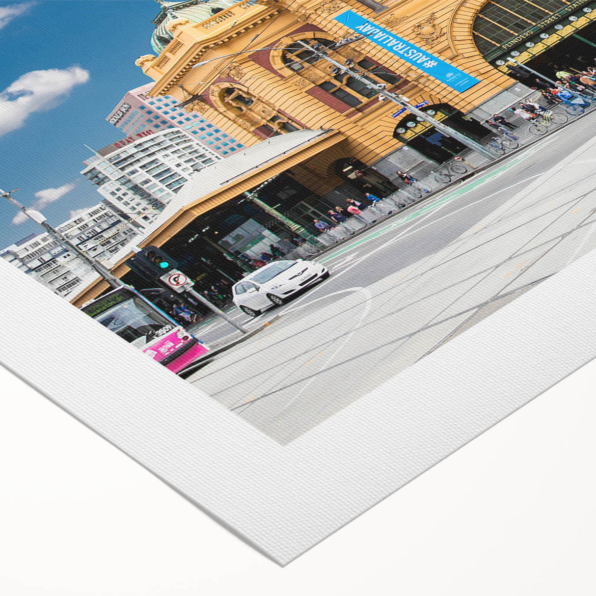 Art deco poster of Melbourne skyline in muted gold and blue tones on rolled canvas, suitable for dining room wall art.