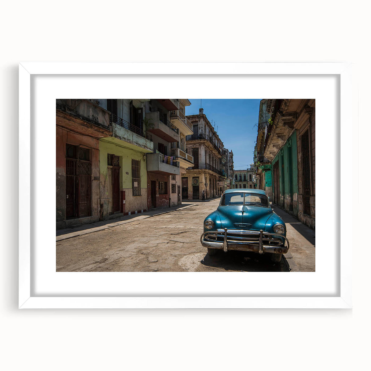 Textured abstract art print depicting a Caribbean Cuba scenery in vibrant colors on a framed white mat.