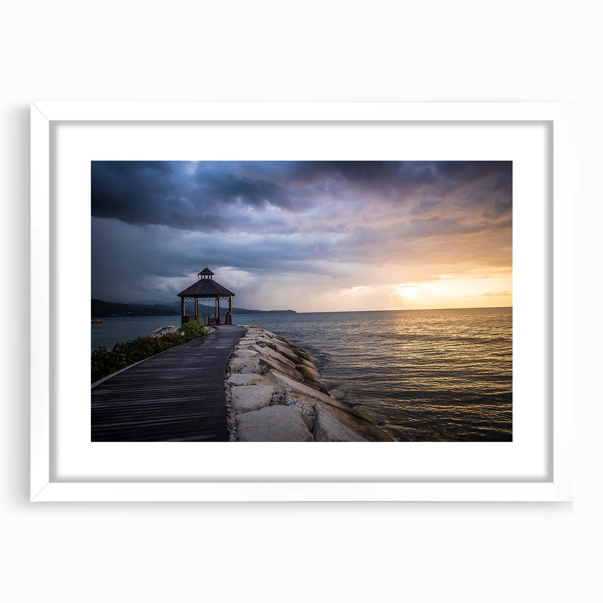 Textured abstract art print of Caribbean scenery in muted blue and green, framed with a white mat, ideal for bedroom art.