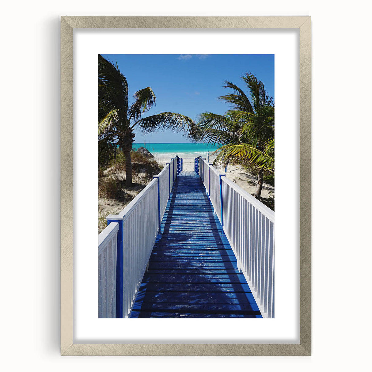 Extra large abstract art print of Caribbean scenery in muted blue and green tones, framed in silver.