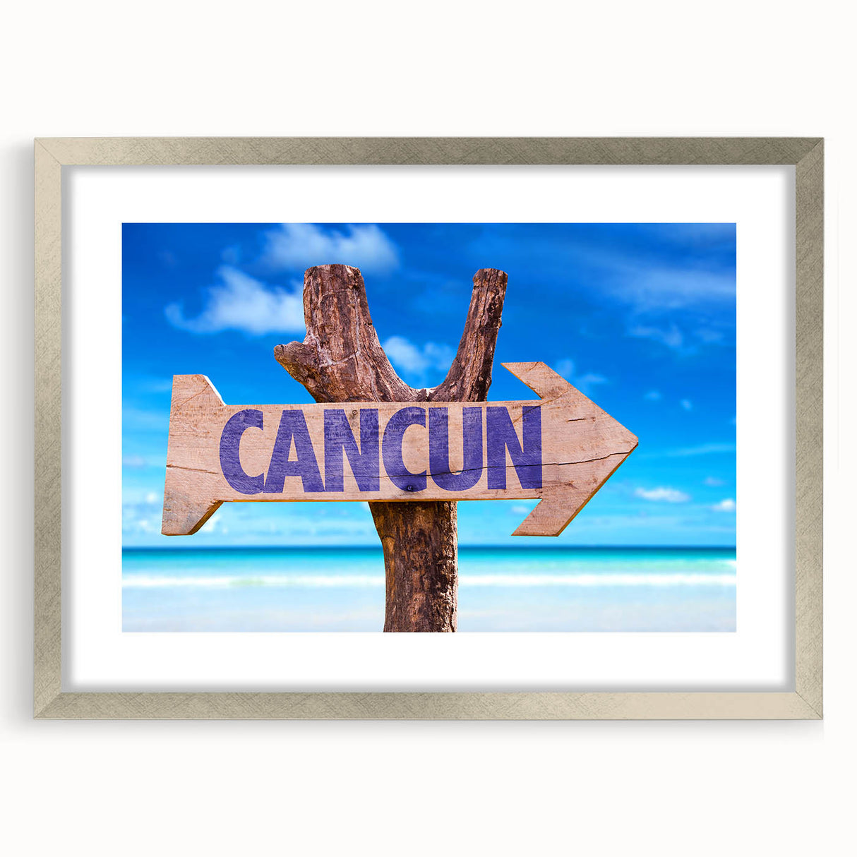 Textured abstract art print of Cancun scenery in muted blue and green tones, framed in silver, ideal for bedroom art.