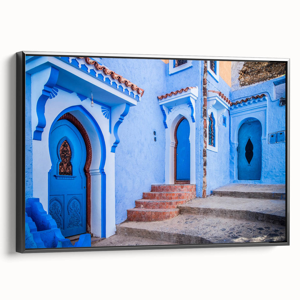 Black and white framed canvas of a Moroccan landscape, ideal for bedroom wall art in a vintage poster style.
