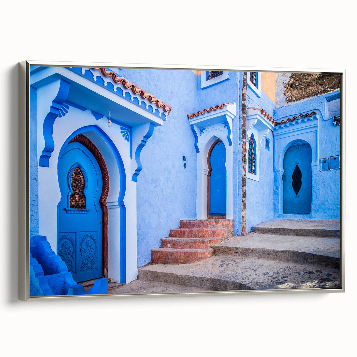 Vintage poster art of a Moroccan landscape in vibrant colors on a framed canvas, ideal for living room decor.