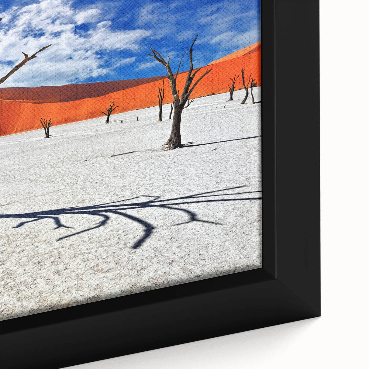 Framed canvas of a textured African landscape in black with colorful accents, ideal for large living room walls.