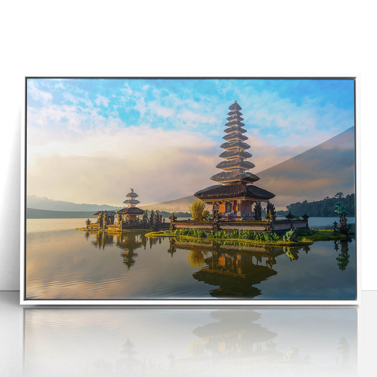 Art deco poster of an Indonesian landscape in muted greens and blues, acrylic print framed in white.