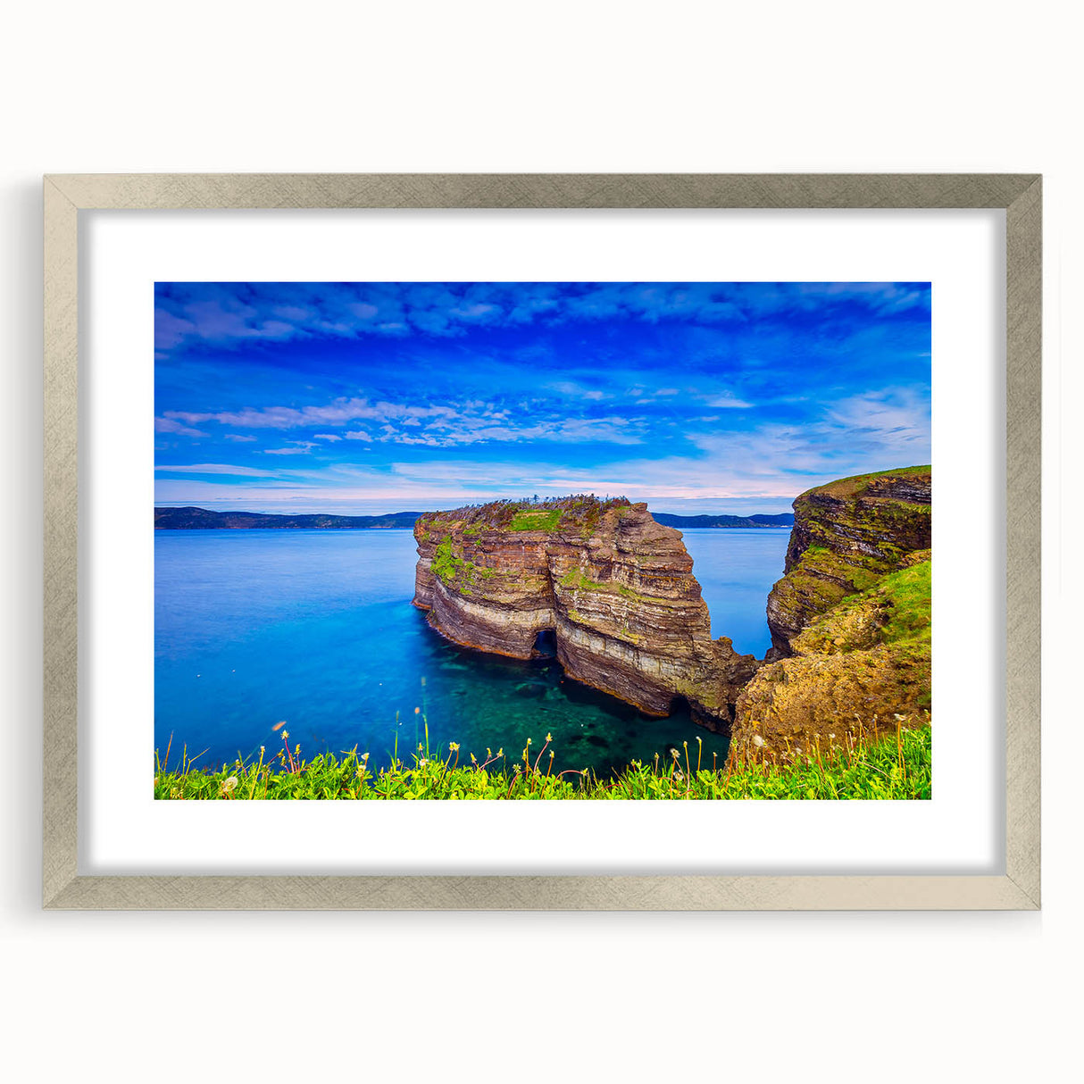 Textured abstract art print of Newfoundland scenery in muted earth tones, framed in silver, suitable for bedroom decor.