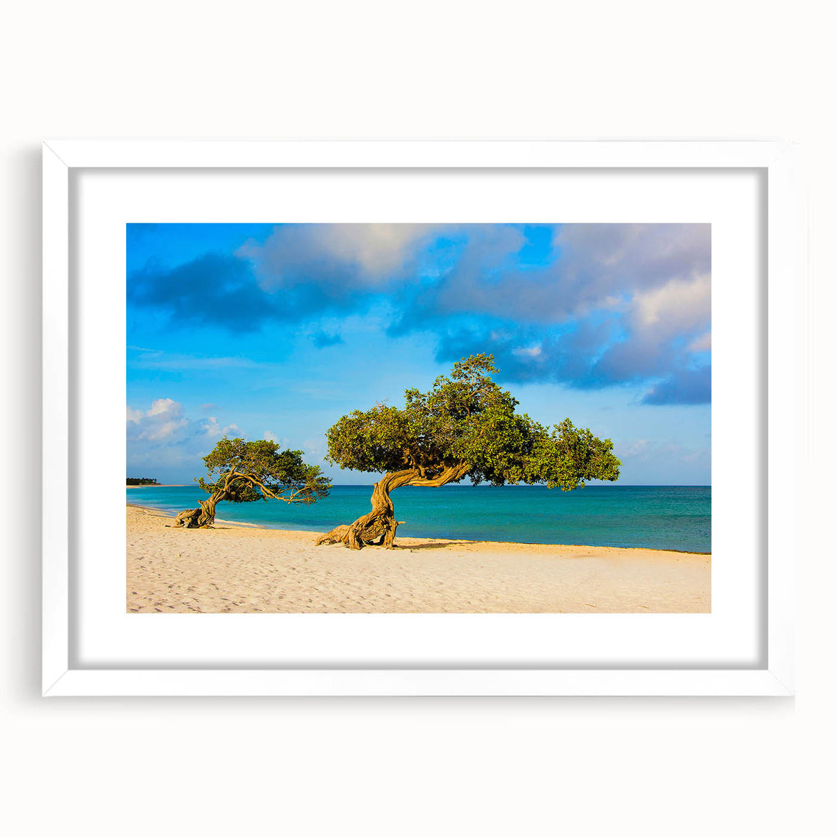 Textured abstract art print of Caribbean scenery in muted blue and green, framed in white, ideal for bedroom art.
