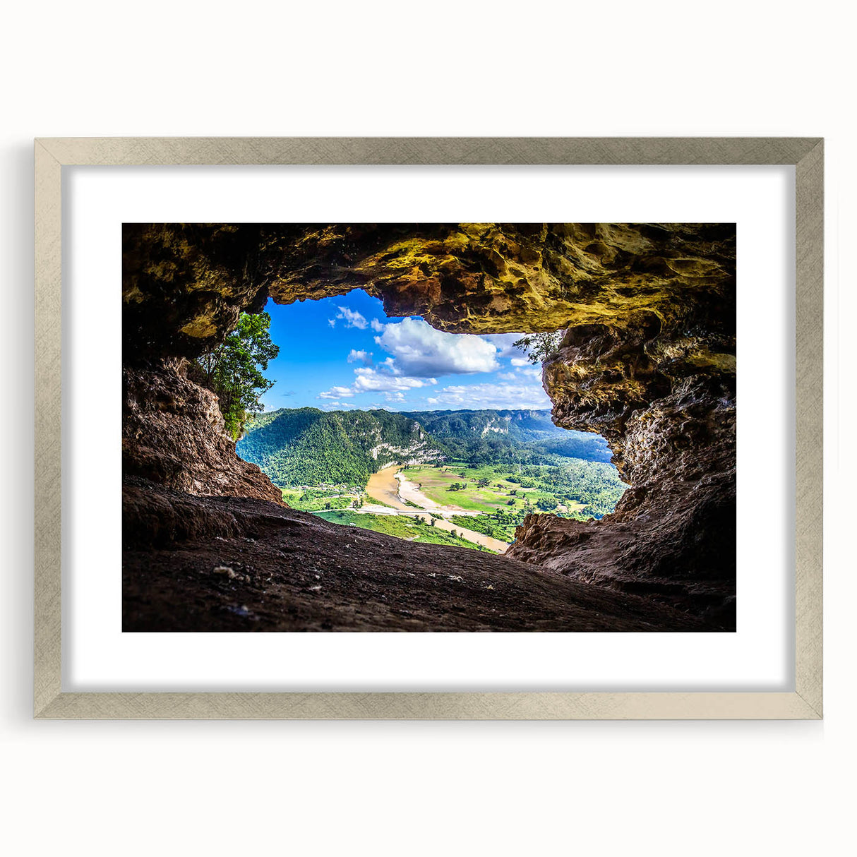 Extra large abstract art print of a Caribbean scene in muted blue and green tones, framed in silver.