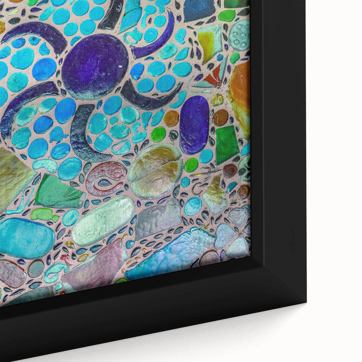 Close-up of textured black wall art depicting Cabo San Lucas scenery on a framed canvas, featuring vibrant colors.
