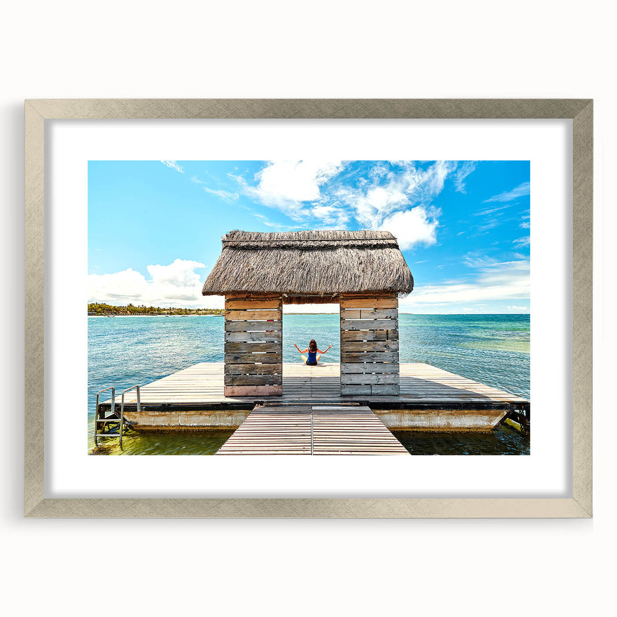 Abstract art print of a Mauritian landscape in cool blue and green tones on a silver-framed mat.