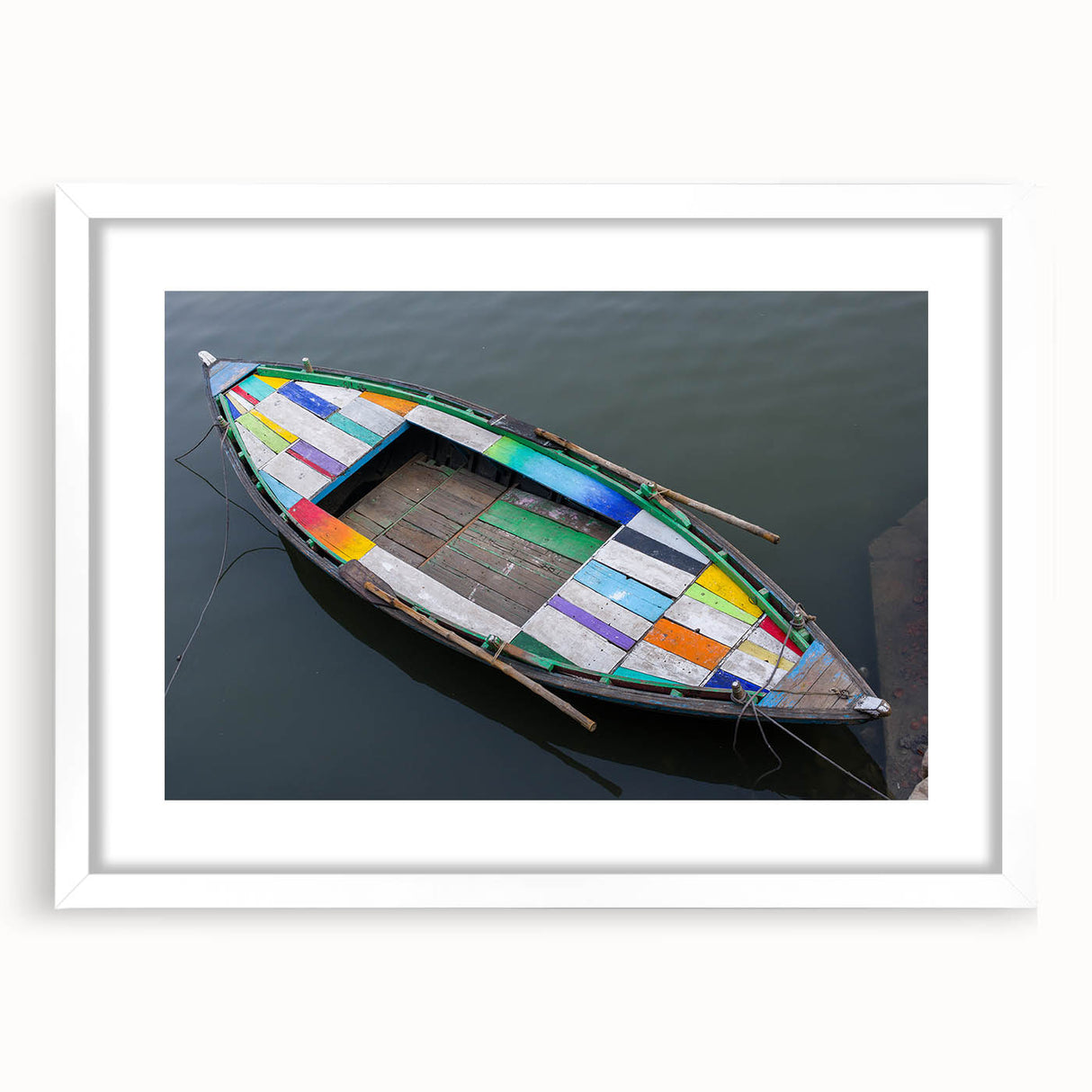 Abstract art print of Indian scenery in muted earth tones on a white matted frame, suitable for dining room decor.