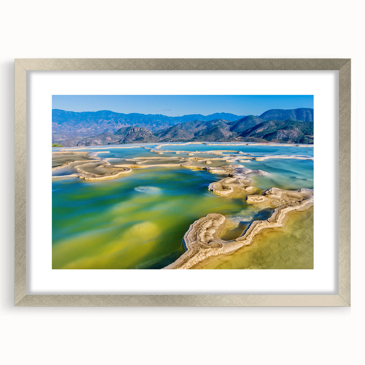Textured abstract art print of Oaxaca scenery in muted earth tones, framed in silver, ideal for bedroom decor.