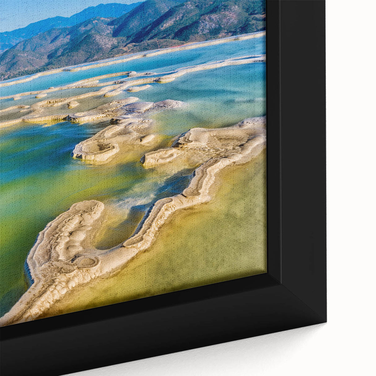 Extra large framed canvas featuring a textured, colorful Oaxacan landscape on black background, ideal for living room decor.