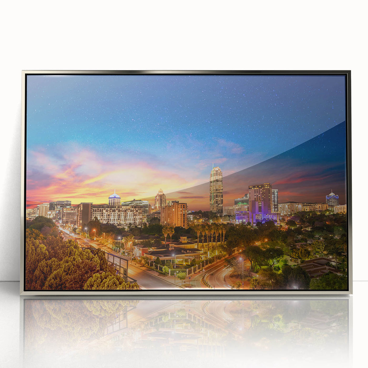 Mid-century modernist art depicting an African savannah scene in muted earth tones on a silver-framed acrylic print.