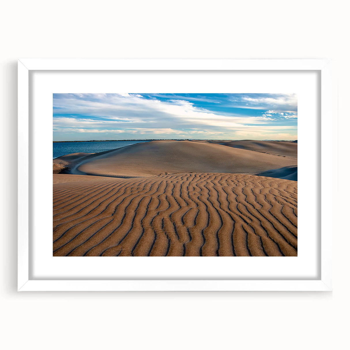 Abstract art print depicting the rugged landscapes of Baja California in muted earth tones, framed in white.