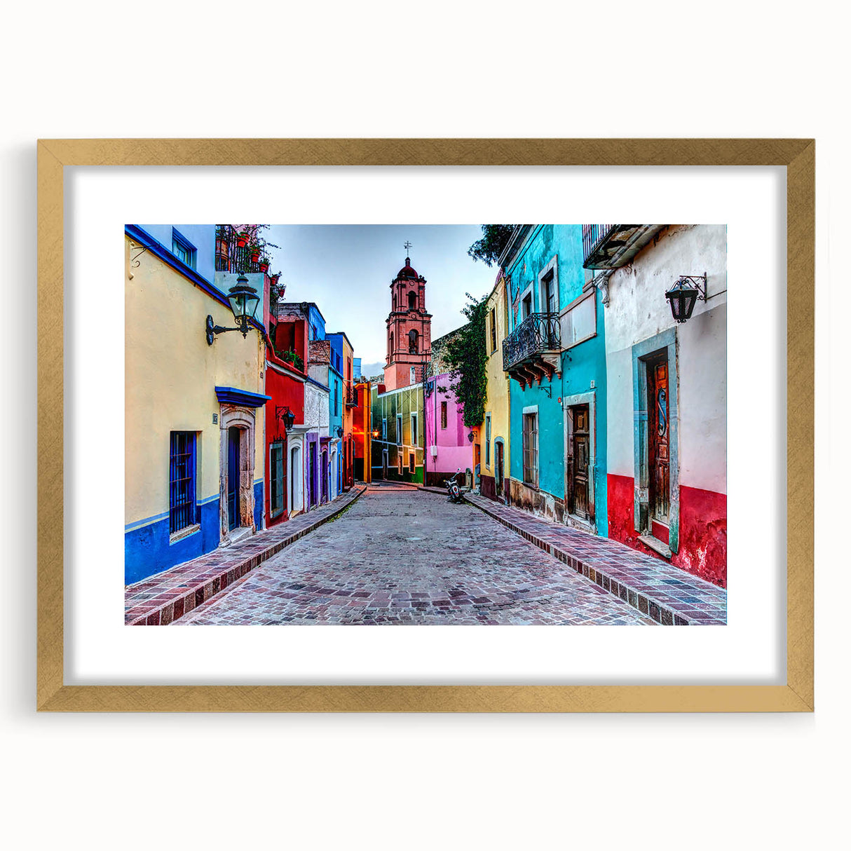 Extra large abstract art print depicting textured scenery of Guanajuato, with vibrant hues, framed in gold.