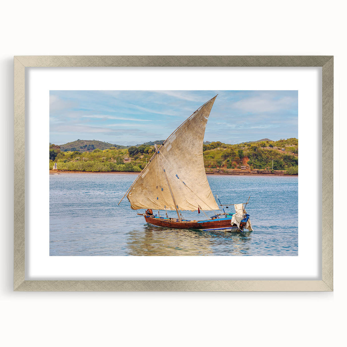 Abstract art print of a Madagascar landscape in muted earth tones on a framed silver canvas, suitable for dining room decor.
