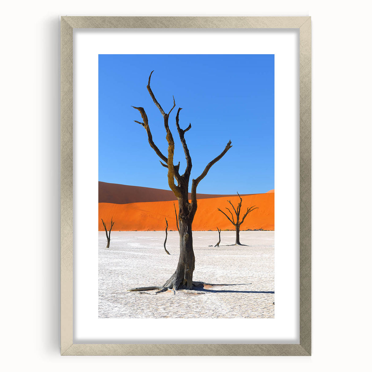 Textured art depicting abstract African scenery in earthy tones on a silver-framed matte canvas, suitable for bedroom decor.