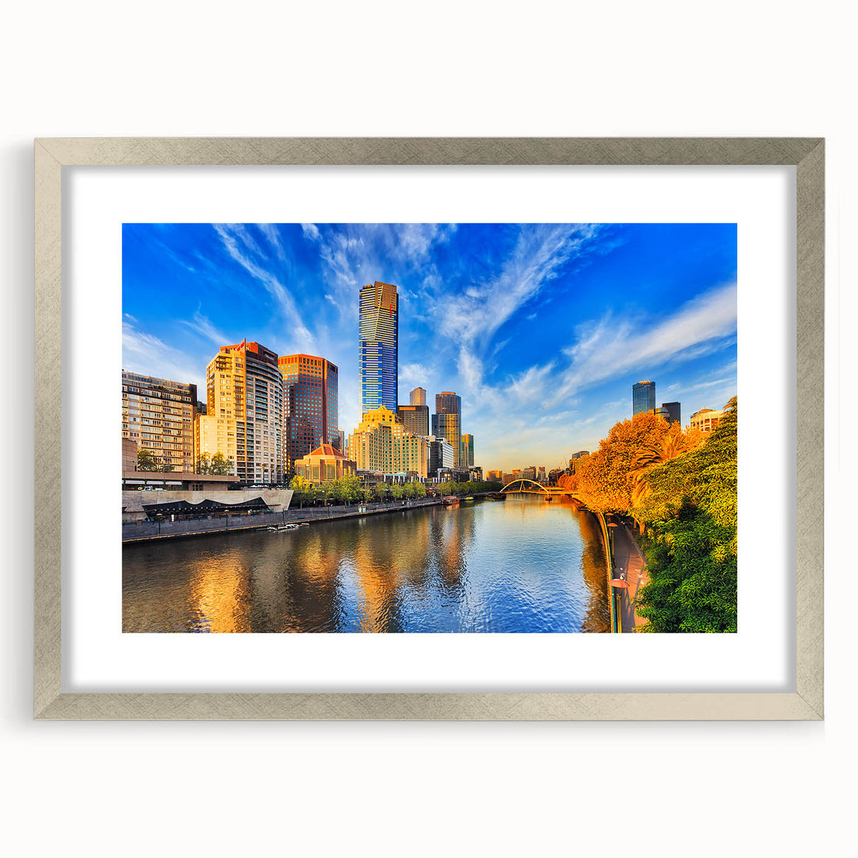 Abstract art print of Melbourne skyline in muted blue and gray shades on a framed silver canvas.