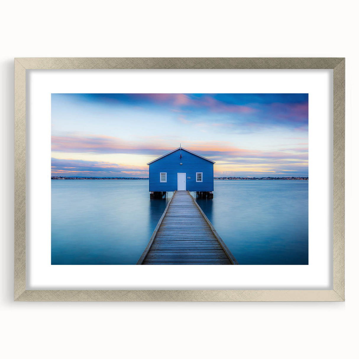 Abstract art print of Perth skyline in muted blue and silver tones, framed with a silver mat, suitable for dining room decor.