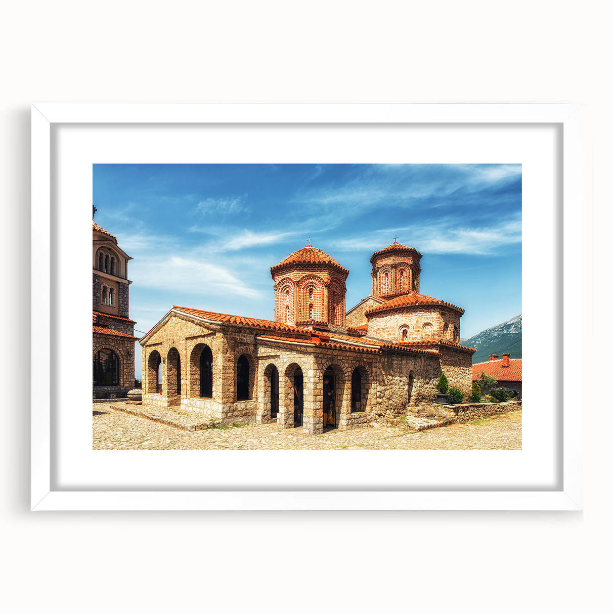 Textured abstract art print of a European scenery in Albania, displayed in a white frame with mat, ideal for bedroom art.