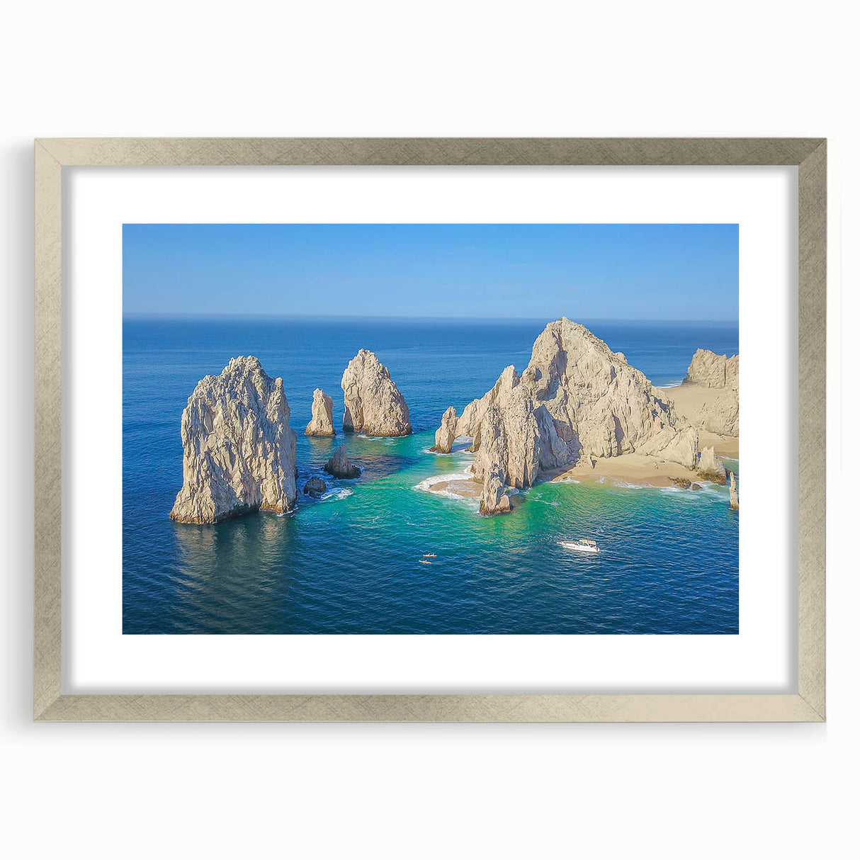 Textured abstract art print of Cabo San Lucas with muted earth tones on a framed silver mat, suitable for bedroom decor.